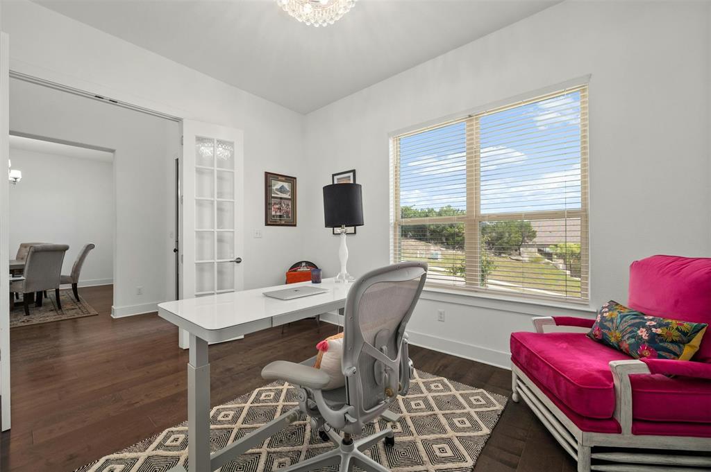 208 Slate Rock Terrace Austin, TX 78738 - Photo 14 of 29 a view of a dining room with furniture window and wooden floor