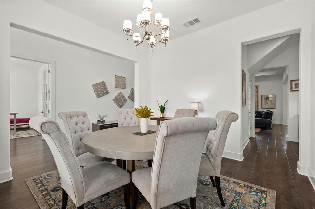 208 Slate Rock Terrace Austin, TX 78738 - Photo 15 of 29 a view of a dining room with furniture and wooden floor
