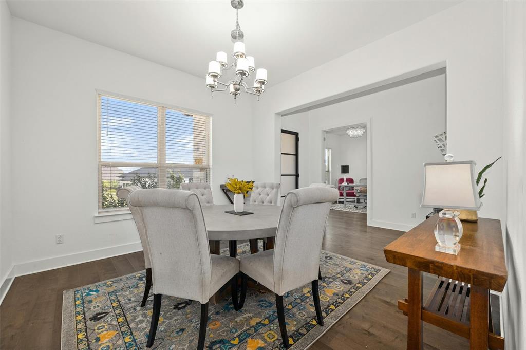 208 Slate Rock Terrace Austin, TX 78738 - Photo 16 of 29 a view of a dining room with furniture and chandelier