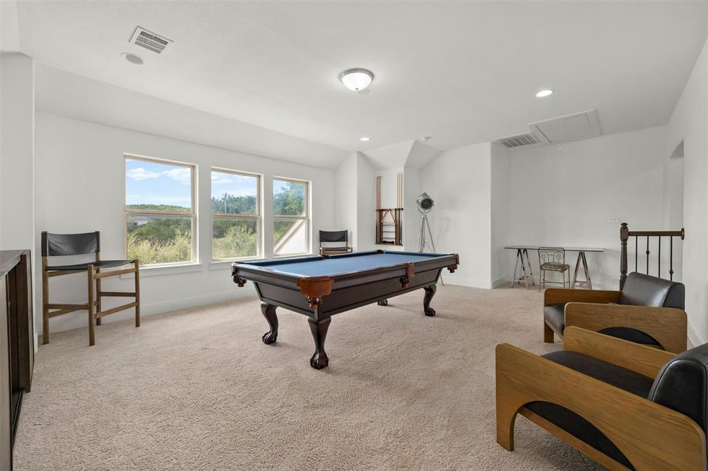 208 Slate Rock Terrace Austin, TX 78738 - Photo 24 of 29 a living room with furniture a window and a table