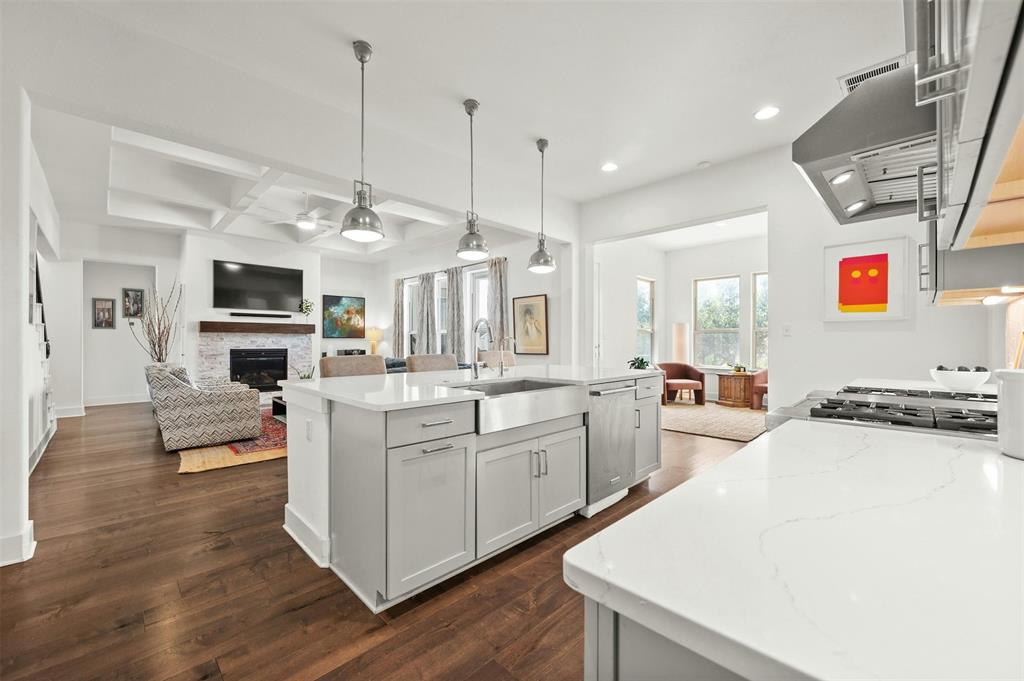 208 Slate Rock Terrace Austin, TX 78738 - Photo 6 of 29 a large white kitchen with stainless steel appliances