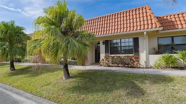 an aerial view of a residential houses with outdoor space