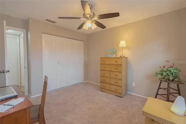 a view of a lake with houses in the back