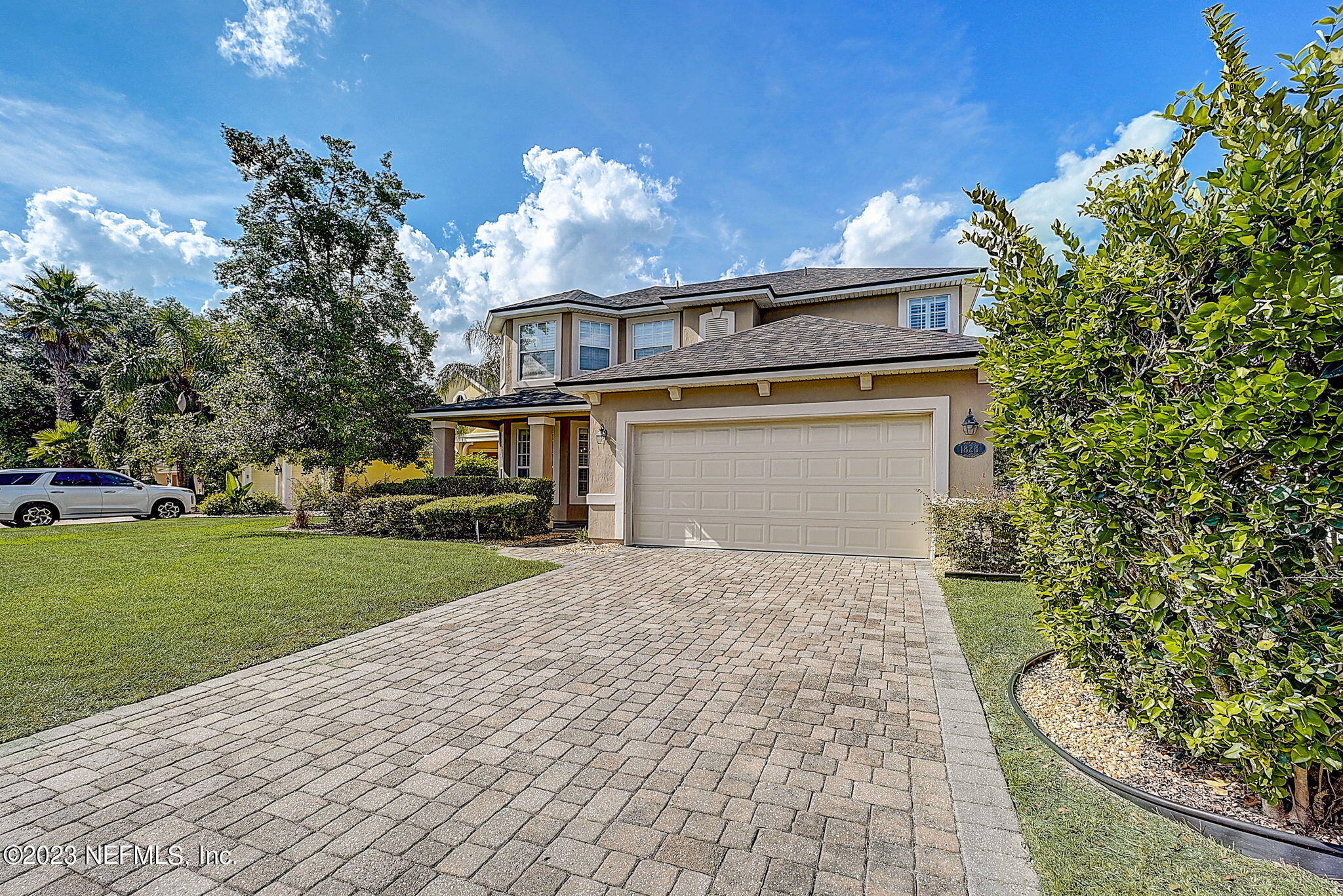 1828 Rear Admiral Lane St. Johns, FL 32259 - Photo 1 of 48 a front view of a house with a yard and a garage