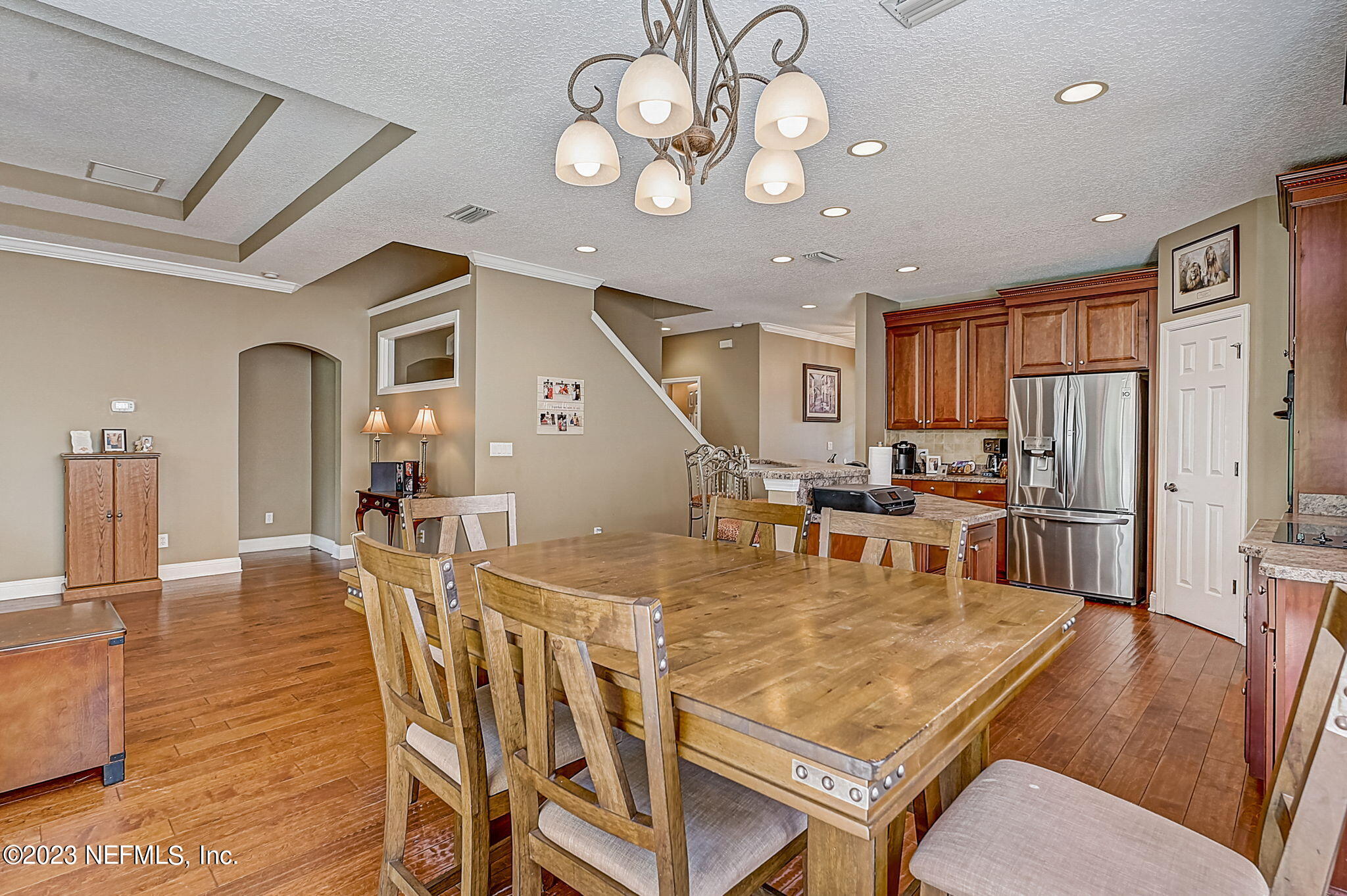 1828 Rear Admiral Lane St. Johns, FL 32259 - Photo 13 of 48 a dining room with wooden floor and stainless steel appliances