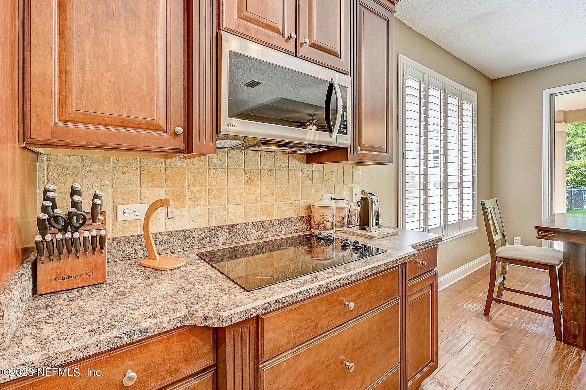 1828 Rear Admiral Lane St. Johns, FL 32259 - Photo 16 of 48 a kitchen with stainless steel appliances granite countertop a sink a stove and cabinets