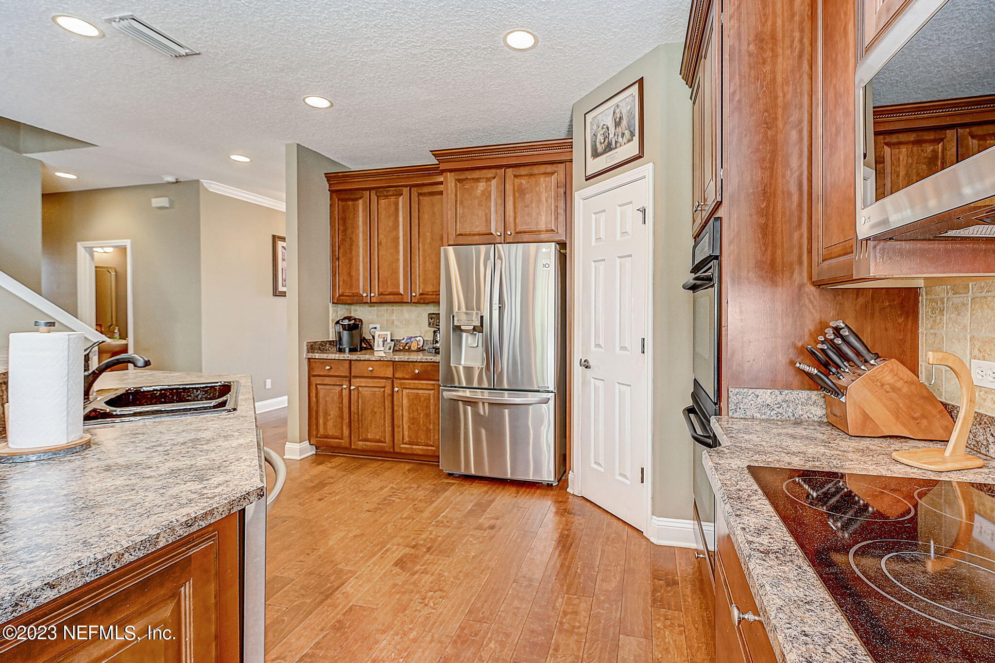 1828 Rear Admiral Lane St. Johns, FL 32259 - Photo 17 of 48 a kitchen with stainless steel appliances granite countertop a refrigerator stove and oven