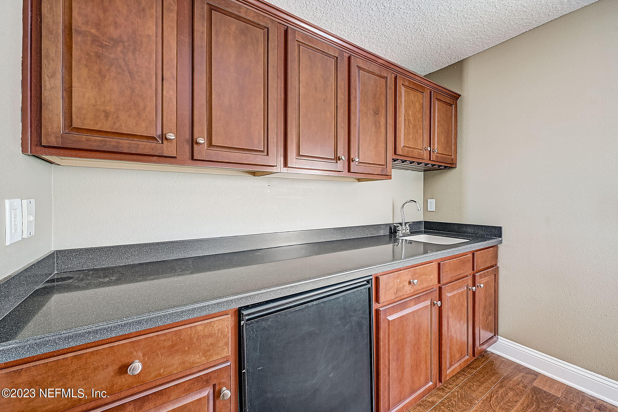 1828 Rear Admiral Lane St. Johns, FL 32259 - Photo 32 of 48 a kitchen with stainless steel appliances granite countertop a sink and cabinets