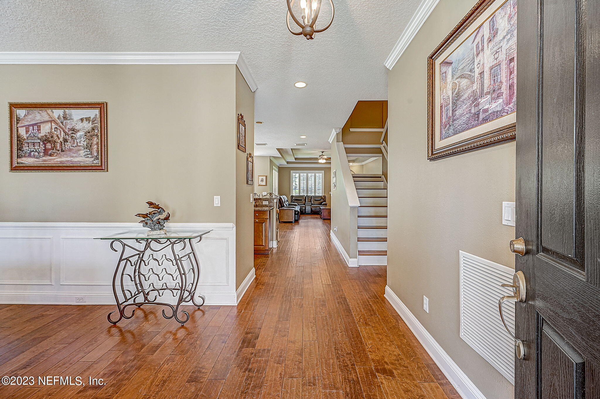 1828 Rear Admiral Lane St. Johns, FL 32259 - Photo 5 of 48 a view of a hallway with wooden floor and furniture