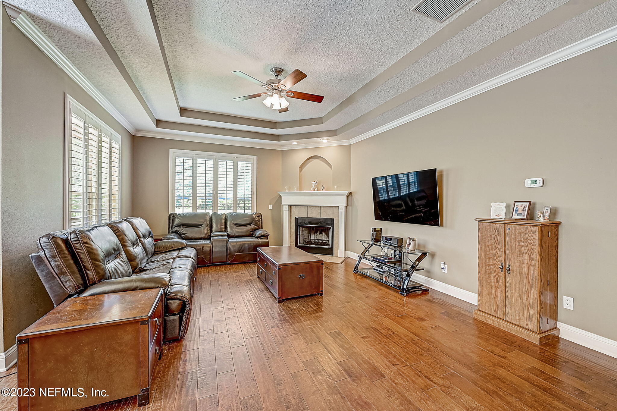 1828 Rear Admiral Lane St. Johns, FL 32259 - Photo 6 of 48 a living room with furniture fireplace and flat screen tv