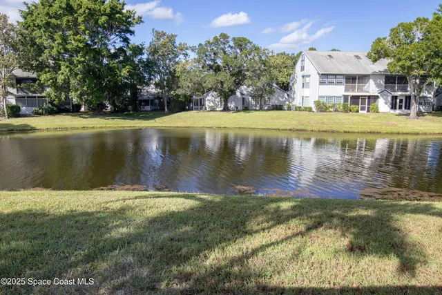 a view of a lake with a building in the background