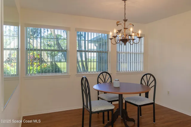 a view of a dining room with furniture window and outside view