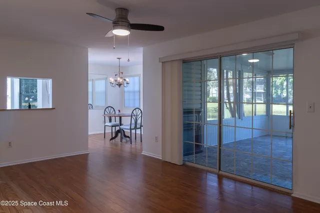 a view of a dining room with hardwood floor
