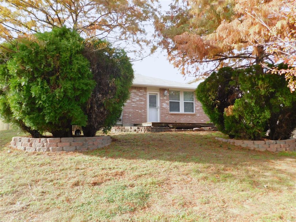 5721 Thoroughbred Trail Denton, TX 76210 - Photo 23 of 24 a view of a house with a yard