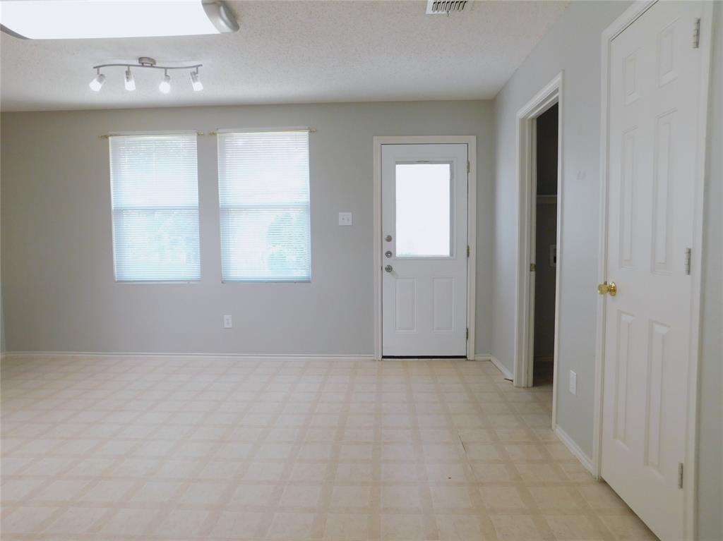 5721 Thoroughbred Trail Denton, TX 76210 - Photo 6 of 24 an empty room with windows and closet