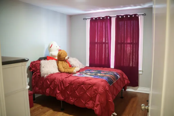 a bedroom with a bed and a window