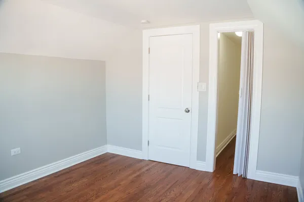 a view of a small space with wooden floor