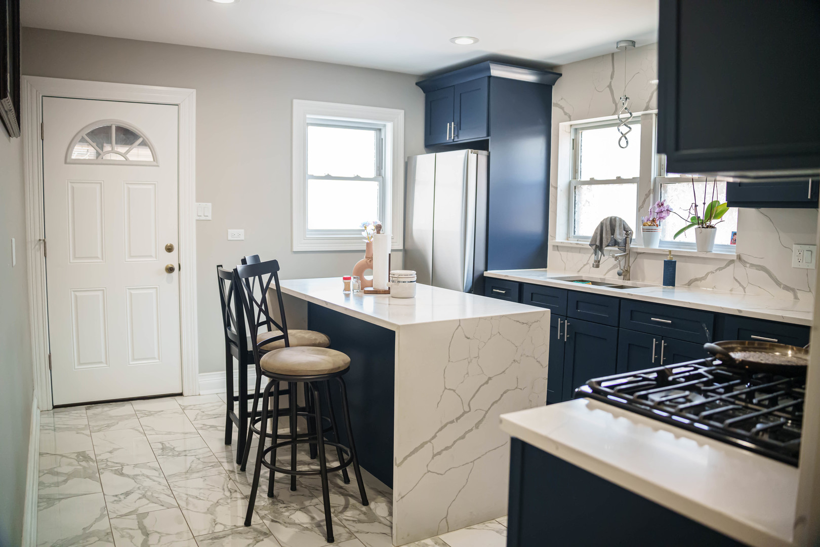 3912 West 55th Place Chicago, IL 60629 - Photo 5 of 20 a kitchen with stainless steel appliances a dining table and chairs
