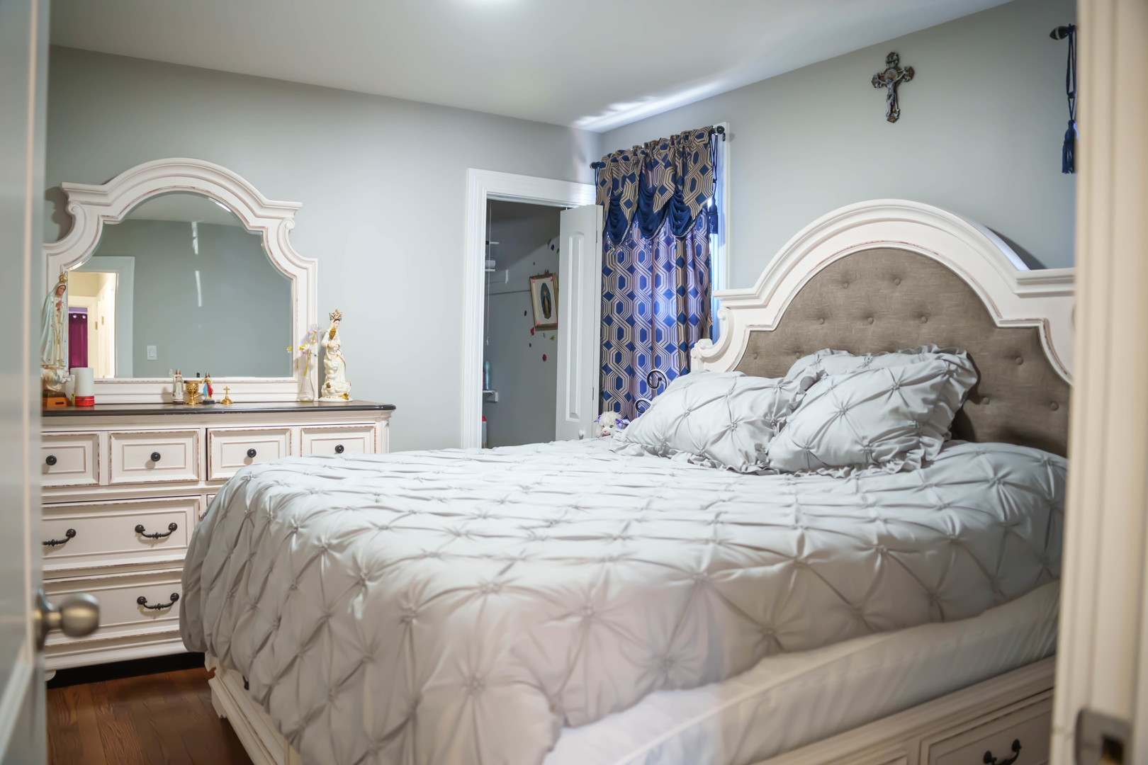 3912 West 55th Place Chicago, IL 60629 - Photo 7 of 20 a bedroom with a bed and a mirror