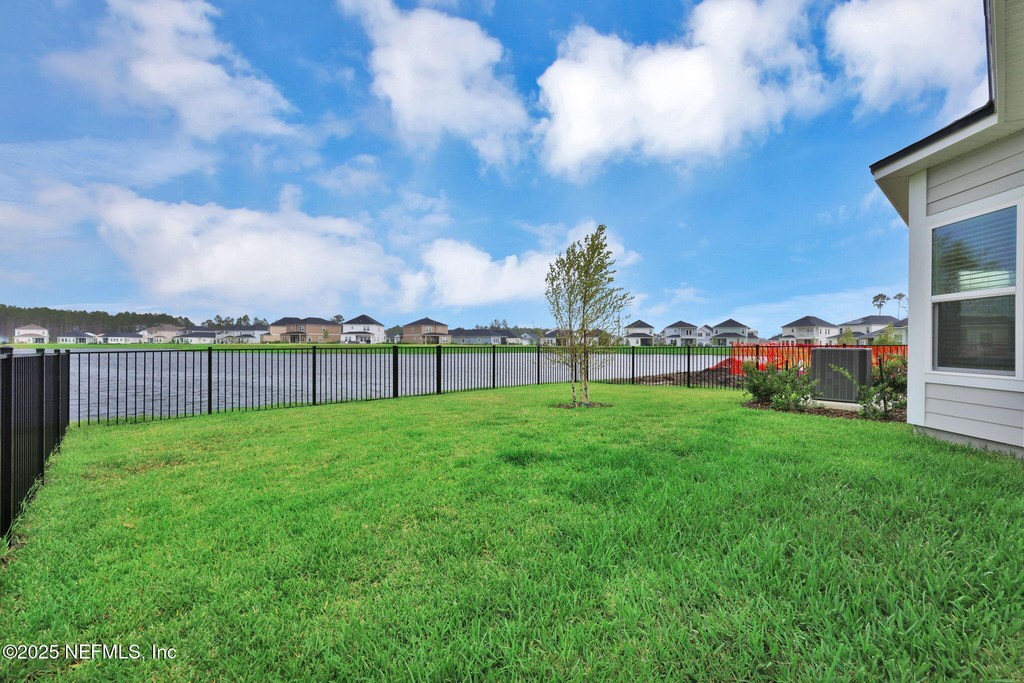 87 Whirlwind Place St. Augustine, FL 32095 - Photo 19 of 44 a view of a yard with a house in the background