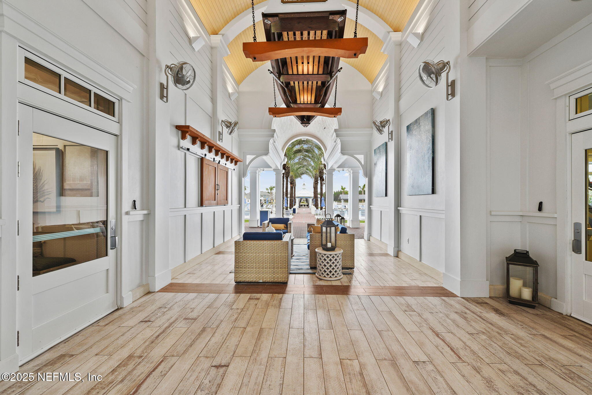 87 Whirlwind Place St. Augustine, FL 32095 - Photo 30 of 44 a living room with fireplace furniture and a wooden floor