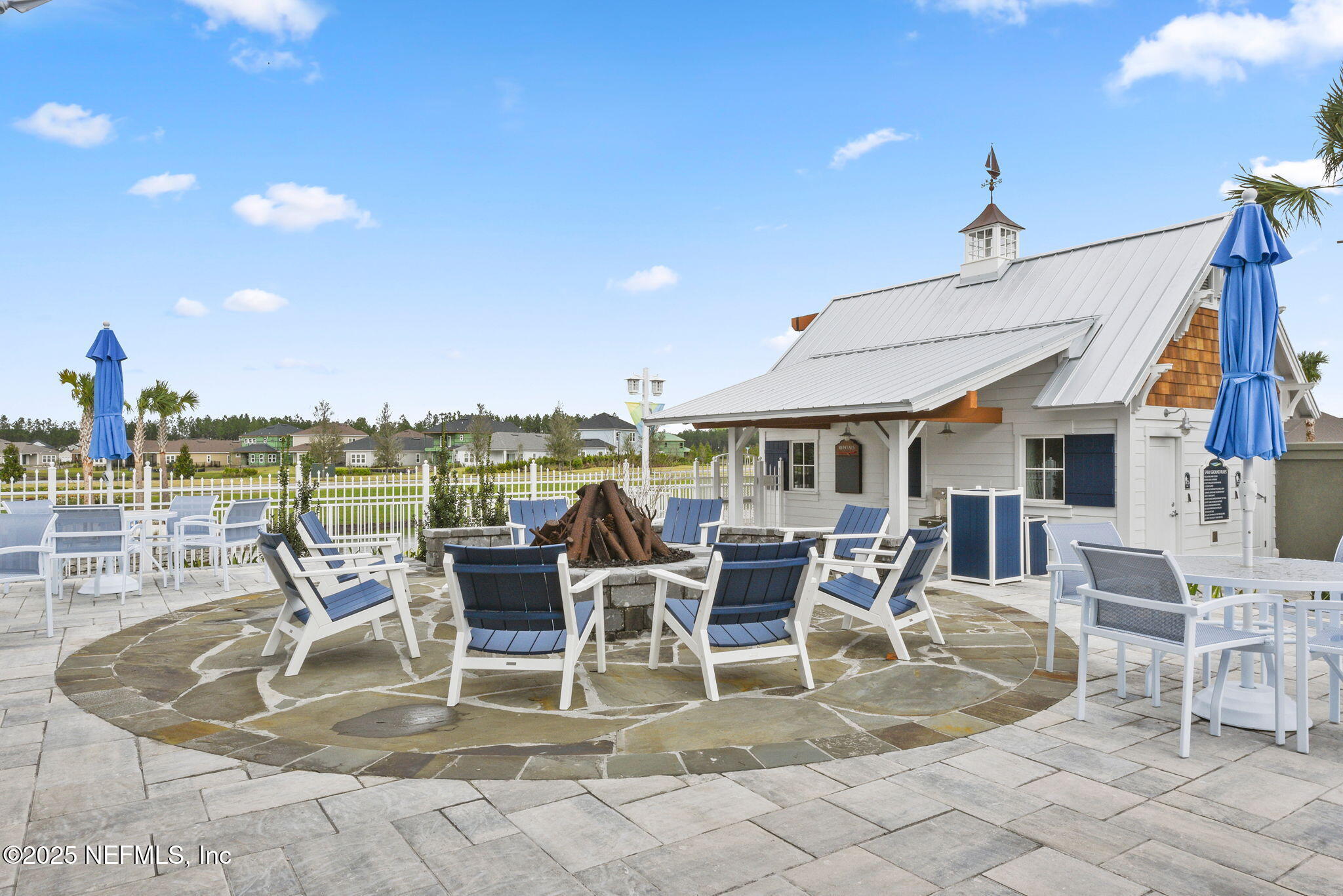 87 Whirlwind Place St. Augustine, FL 32095 - Photo 36 of 44 a view of a patio with dining table and chairs with wooden floor