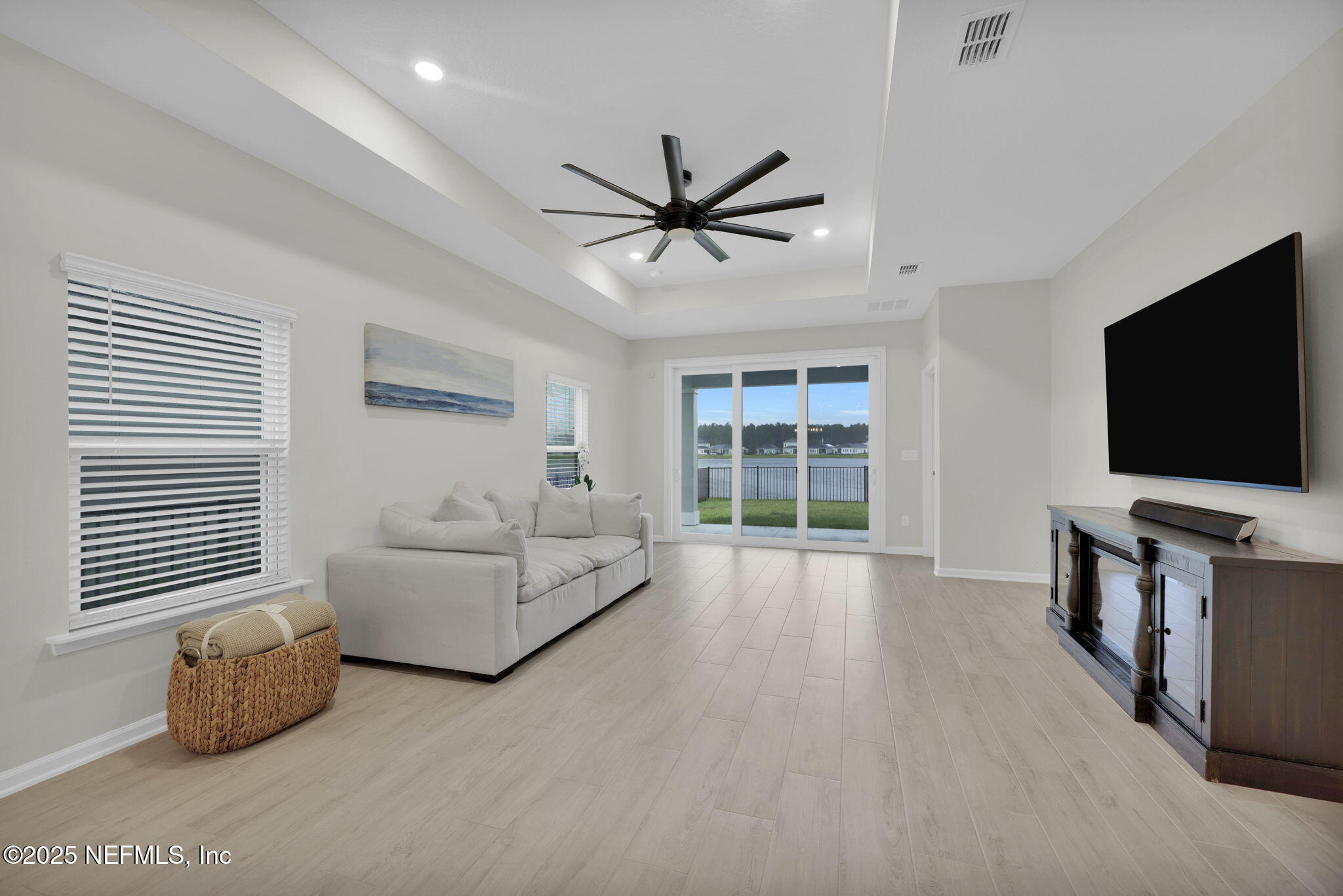 87 Whirlwind Place St. Augustine, FL 32095 - Photo 9 of 44 a living room with furniture and a flat screen tv