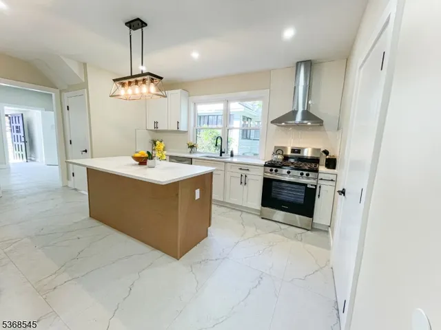 a kitchen with a stove and a sink