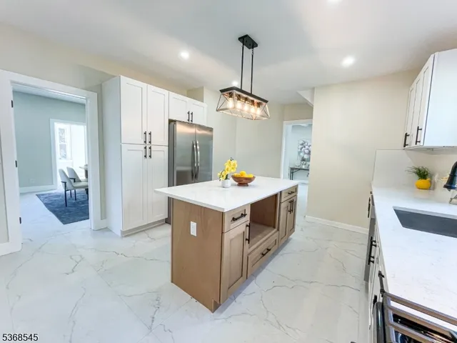 a kitchen with stainless steel appliances granite countertop a stove and a sink