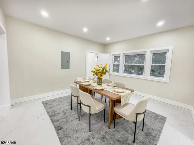 a view of a workspace with furniture and a potted plant