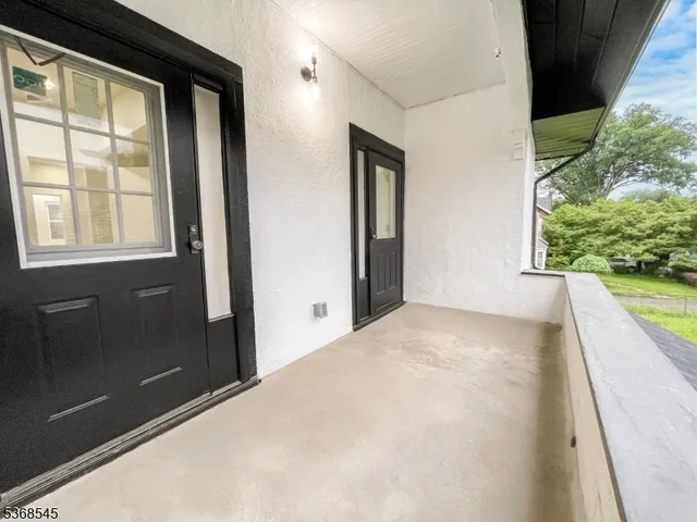 a view of an empty room and a window