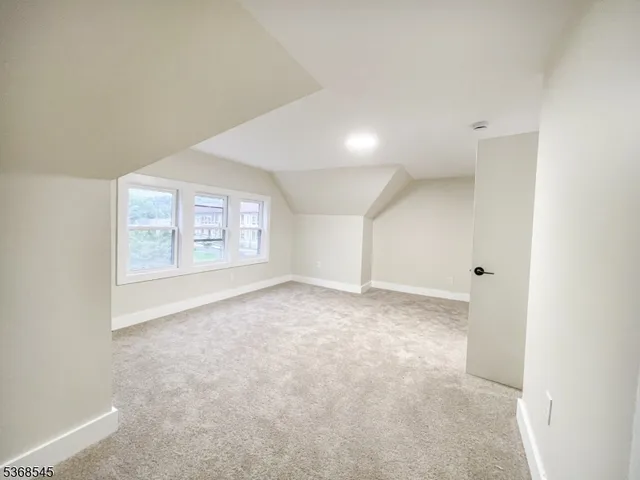 an empty room with a empty space and windows