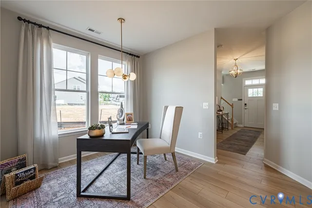 a view of a livingroom with furniture and window