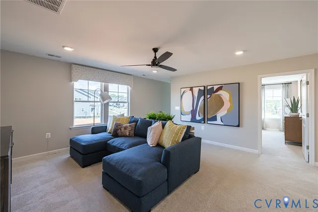 a living room with furniture and window