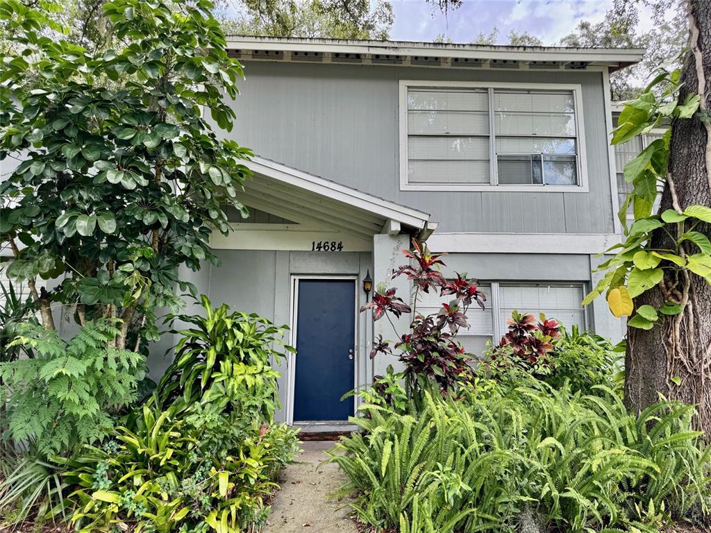 14684 Pine Glen Circle Lutz, FL 33559 - Photo 1 of 1 a front view of a house with a garden