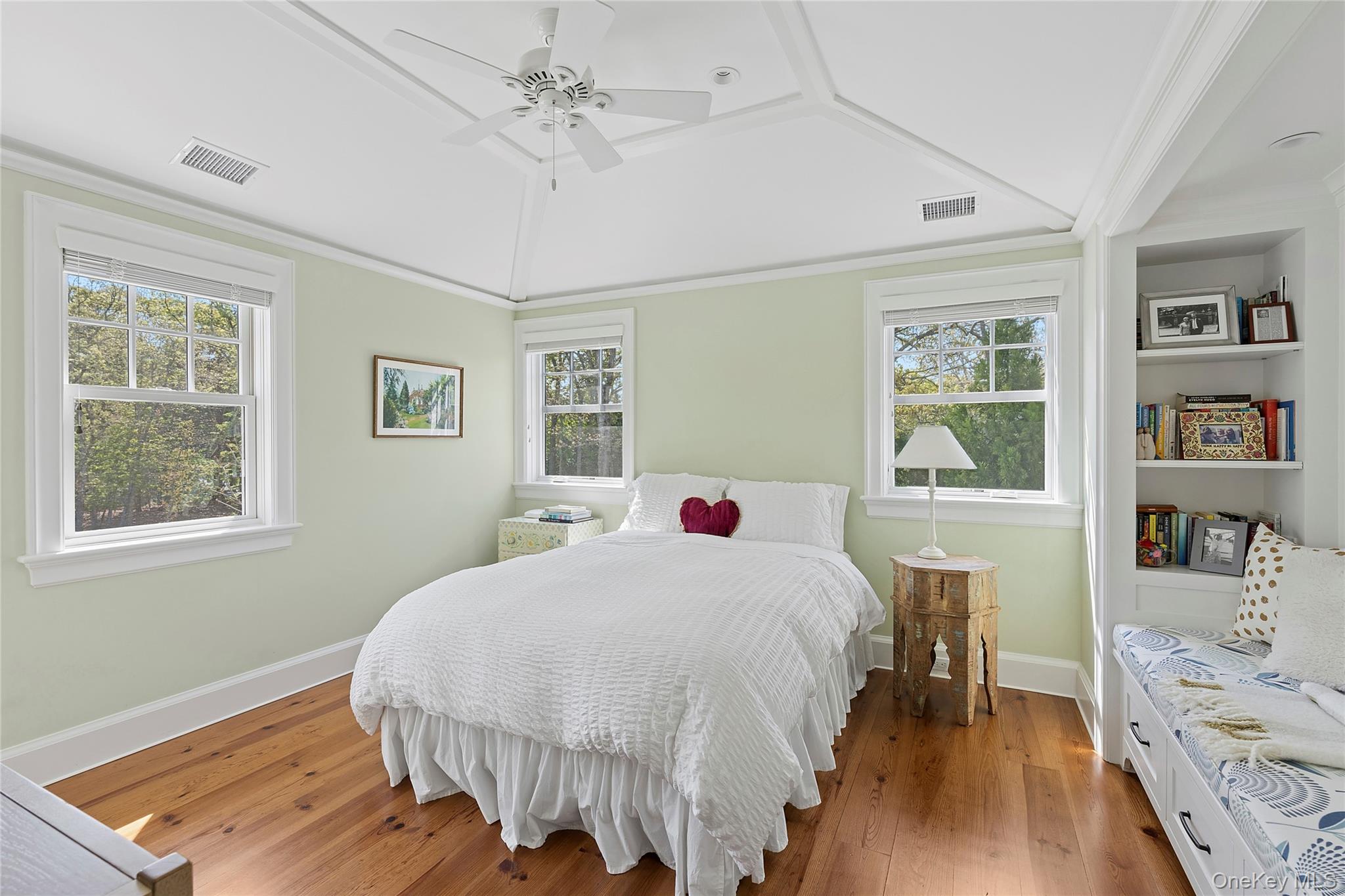 43 Old Main Road Quogue, NY 11959 - Photo 16 of 28 a bedroom with a bed and a table in it