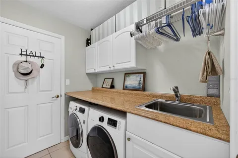 a kitchen with stainless steel appliances granite countertop a sink and dishwasher with wooden cabinets