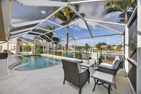 a view of a swimming pool with a patio