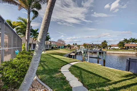 a view of a garden with lawn chairs