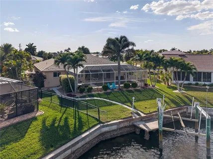 a view of a swimming pool with a lounge chairs