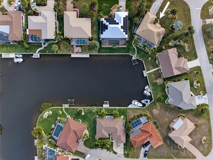 an aerial view of a house with yard swimming pool and outdoor seating