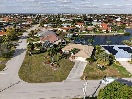 an aerial view of a house with a swimming pool