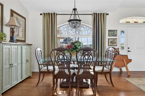 a view of a dining room with furniture window and wooden floor
