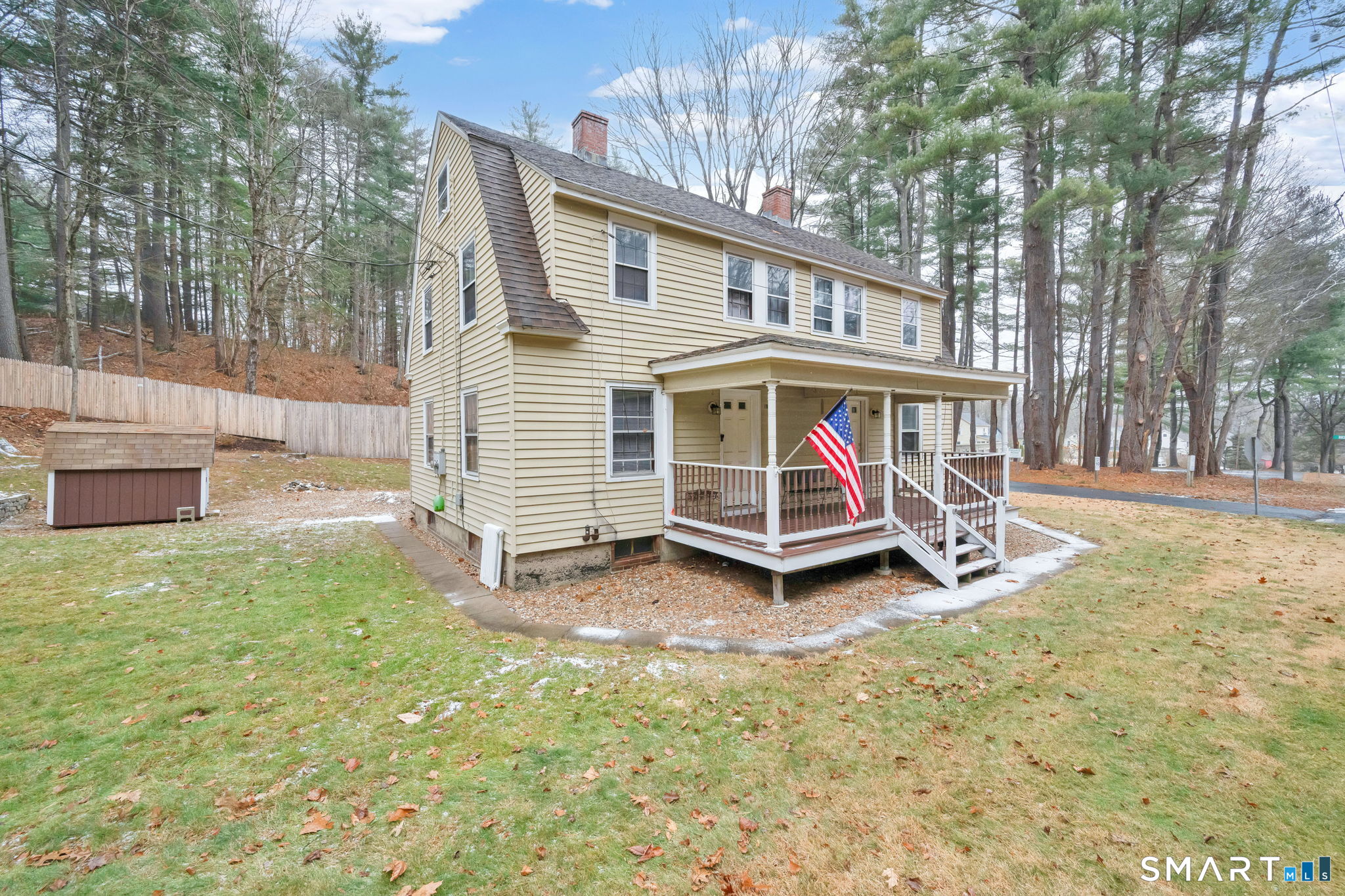 37 Bushy Hill Road Simsbury, CT 06070 - Photo 2 of 23 a view of house with backyard and glass windows