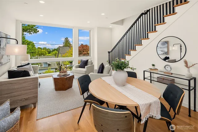 a view of a dining room with furniture window and wooden floor