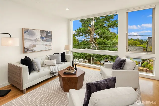 a living room with furniture and a large window
