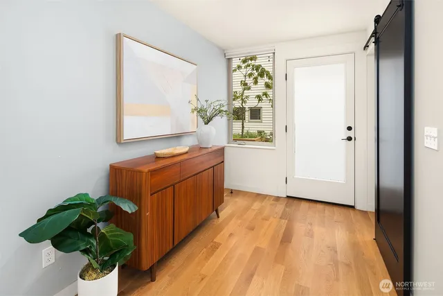 a view of washer and dryer with wooden floor