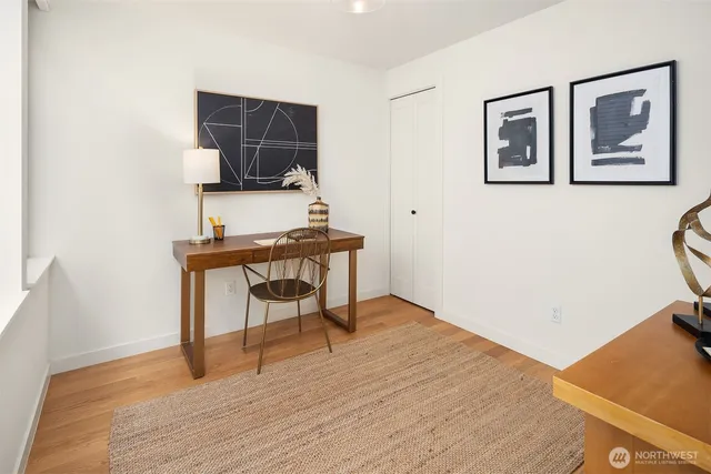 a workspace with furniture and wooden floor