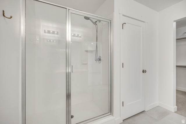 1058 Lilac Way Mapleton, UT 84664 - Photo 13 of 28 Bathroom with a stall shower and a walk in closet