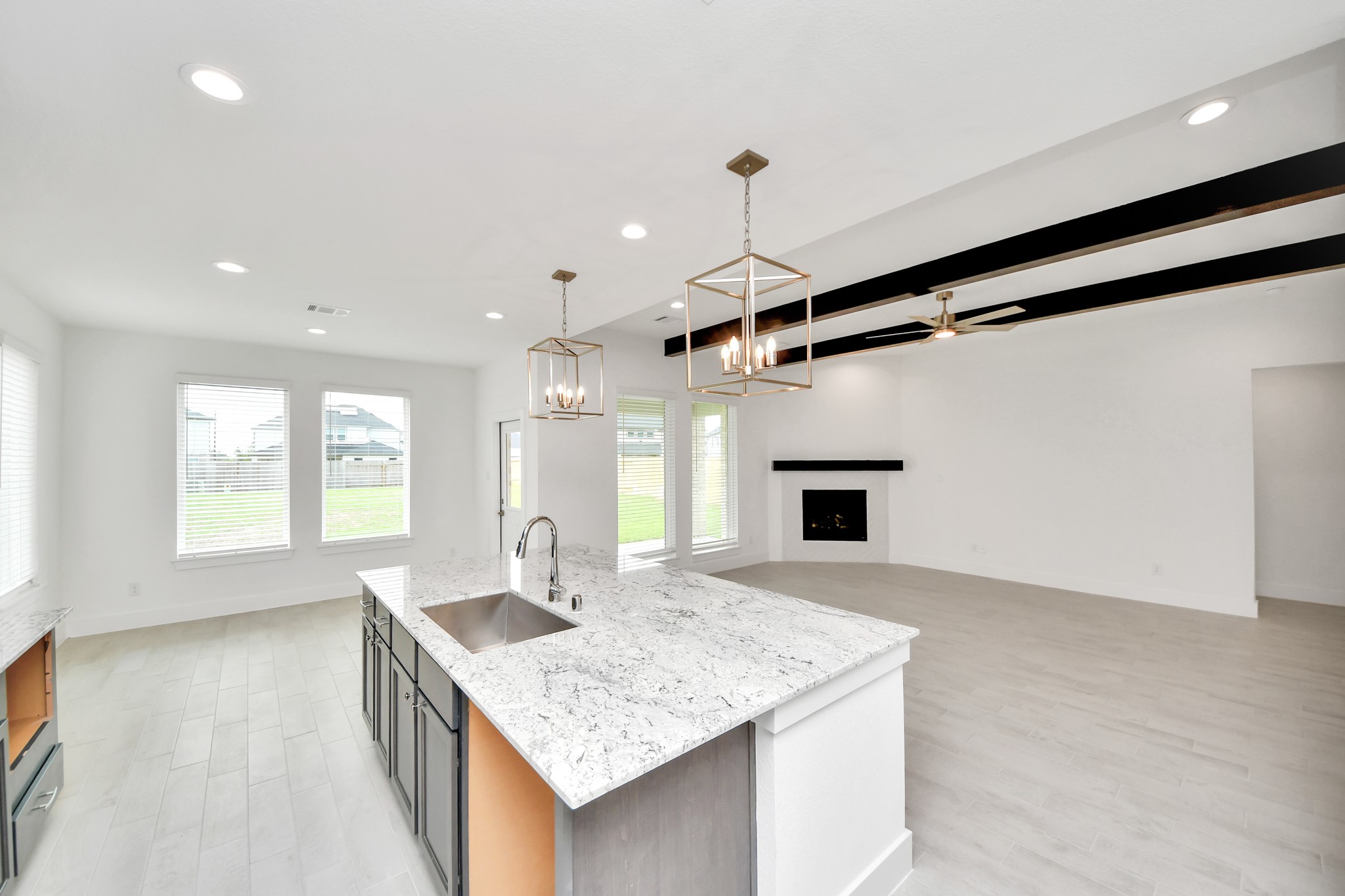 3106 Native Spg Drive Spring, TX 77373 - Photo 16 of 47 The open concept effortlessly connects the kitchen to the expansive family room, forming a perfect hub for gatherings. This seamless flow creates an inviting space where cooking and socializing come together harmoniously.